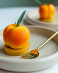 Apricot individual dessert by Batida - lime and thyme financier as the dessert base, close-up