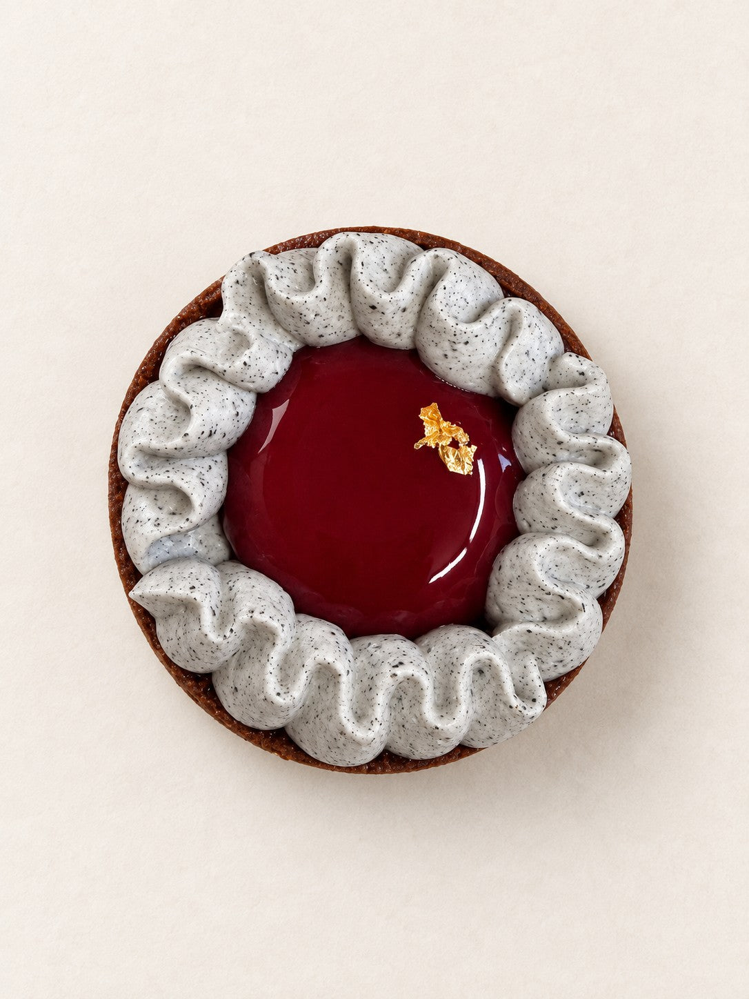 Black Sesame Tartlet by Batida - cocoa shortcrust tart, feuilletine and black sesame ganache