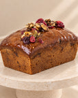 Pumpkin bread with cranberries, close-up of the shiny top and cranberries