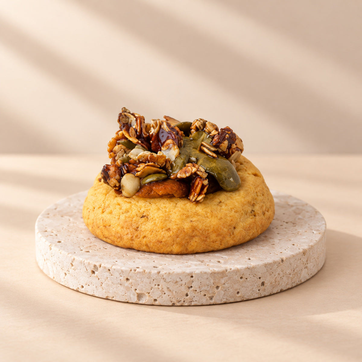 Pumpkin crumble cookie topped with praline pumpkin seeds and nuts