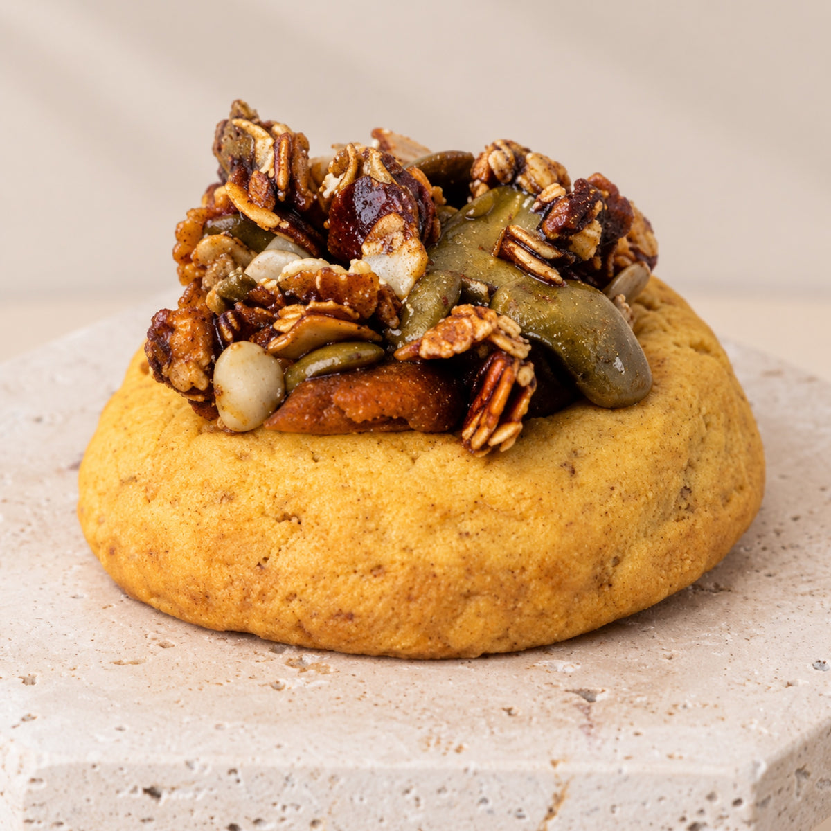 Pumpkin crumble cookie up close, with a crunchy praline crumble