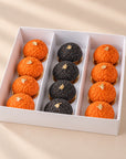 Set mit 12 Halloween-Mini-Windbeuteln, orange und schwarz, in einer weißen Box